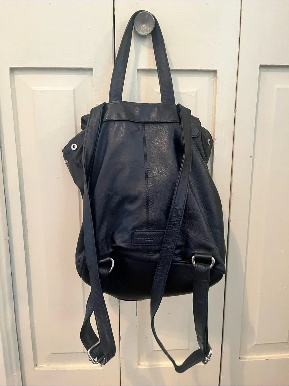 Sleek Black Leather Flap Backpack